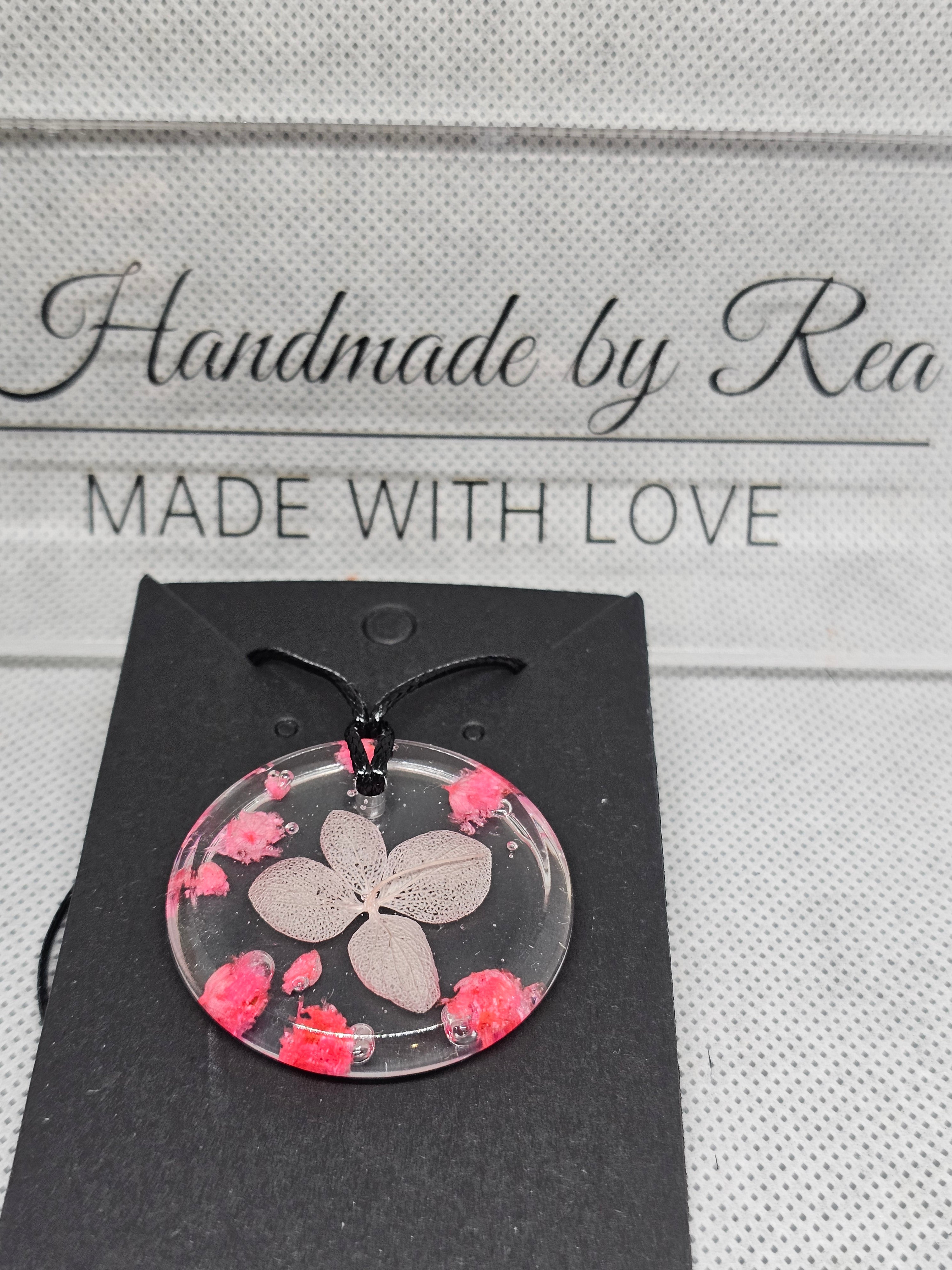 Clear Resin Necklace with Skeleton Leaf & Pink Flowers – Round Pendant
