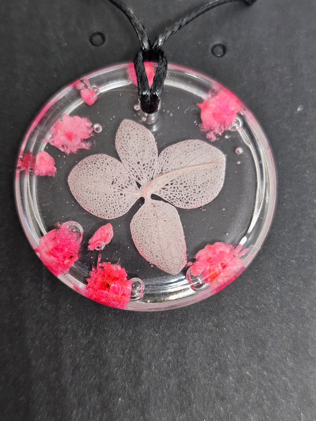 Clear Resin Necklace with Skeleton Leaf & Pink Flowers – Round Pendant