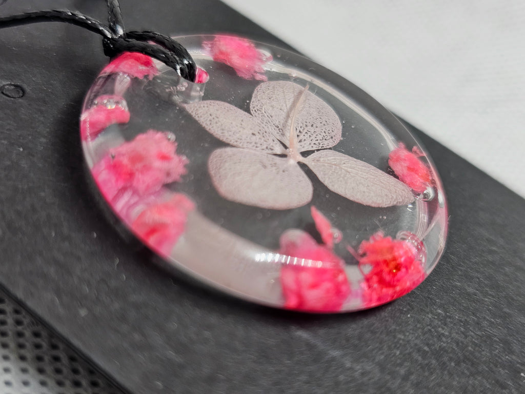 Clear Resin Necklace with Skeleton Leaf & Pink Flowers – Round Pendant