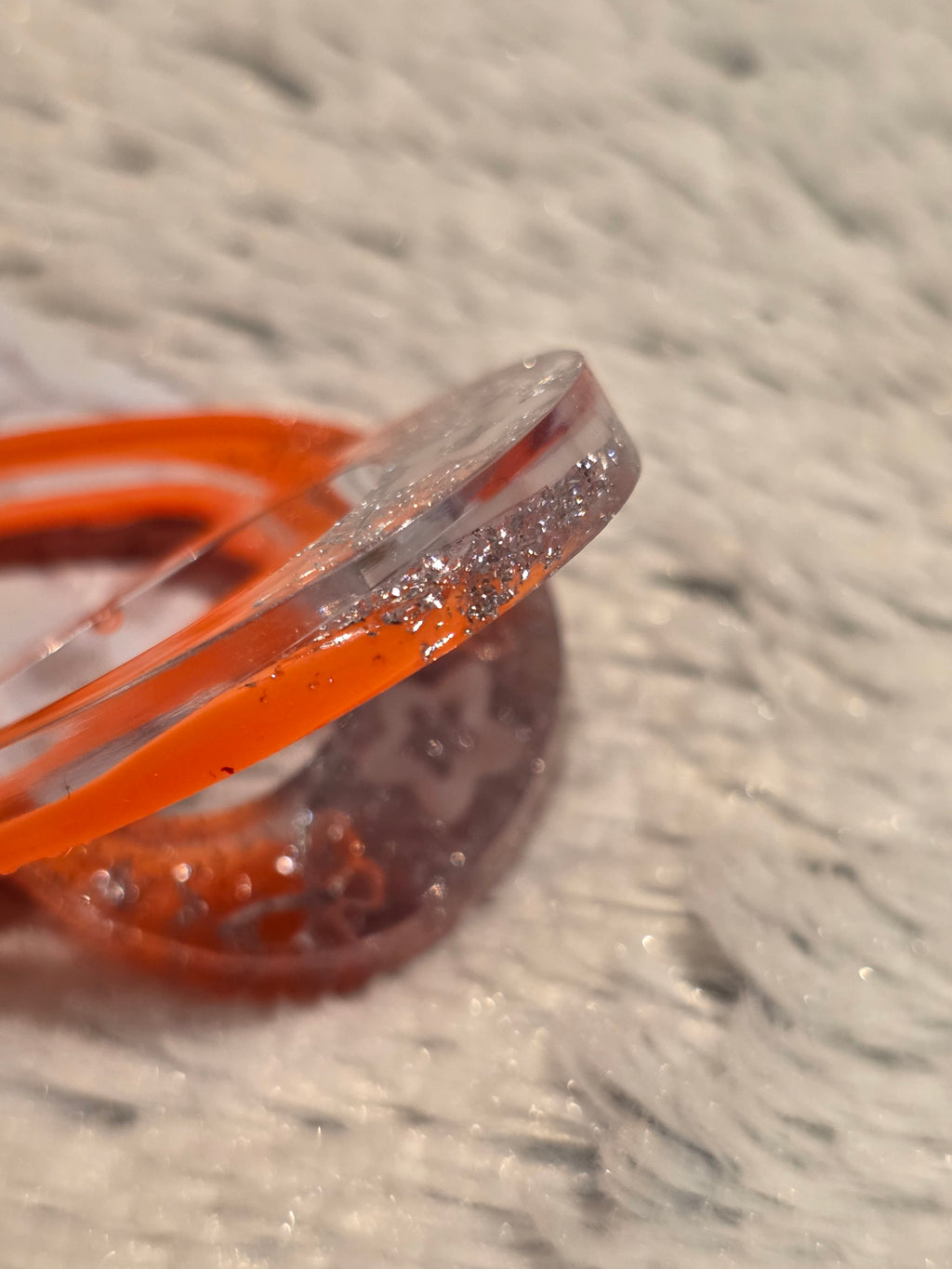 Resin earrings – orange hoops with silver star glitter effect, stainless-steel hooks