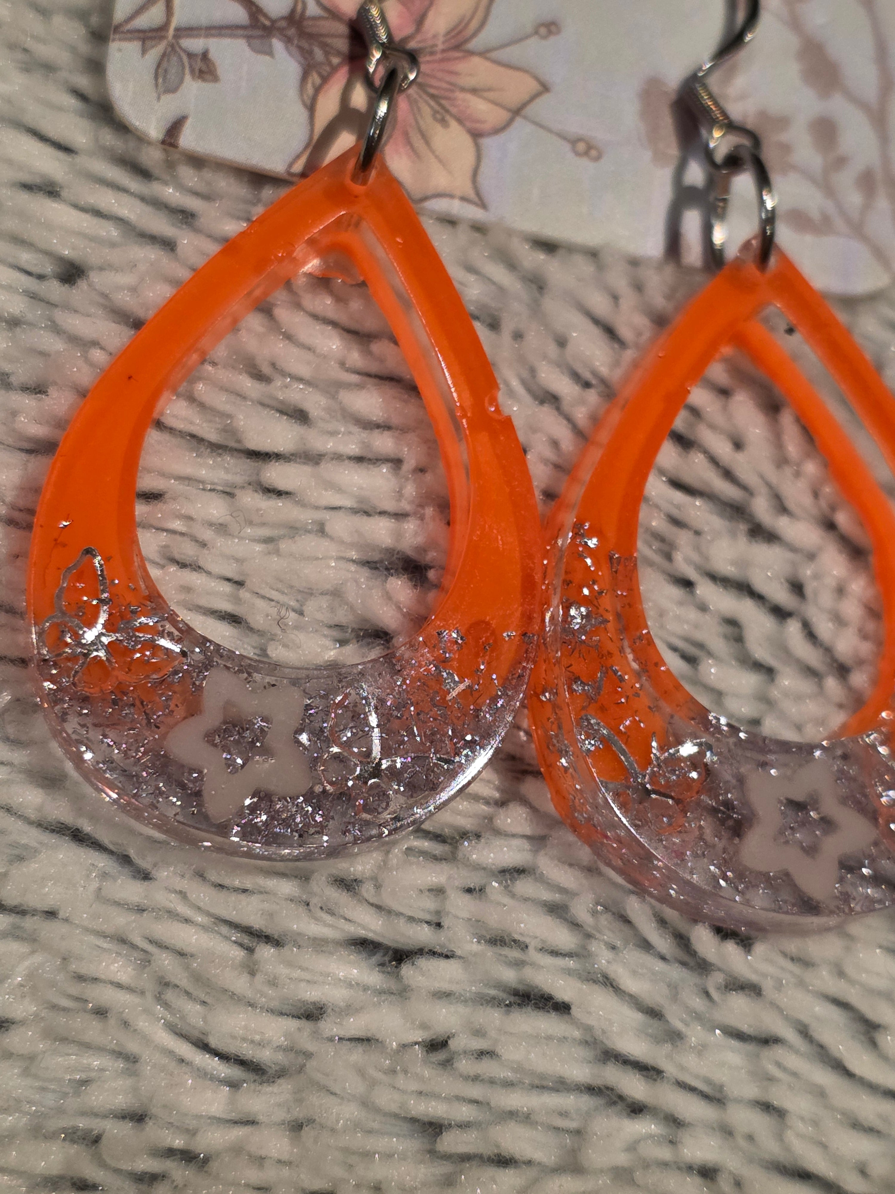 Resin earrings – orange hoops with silver star glitter effect, stainless-steel hooks