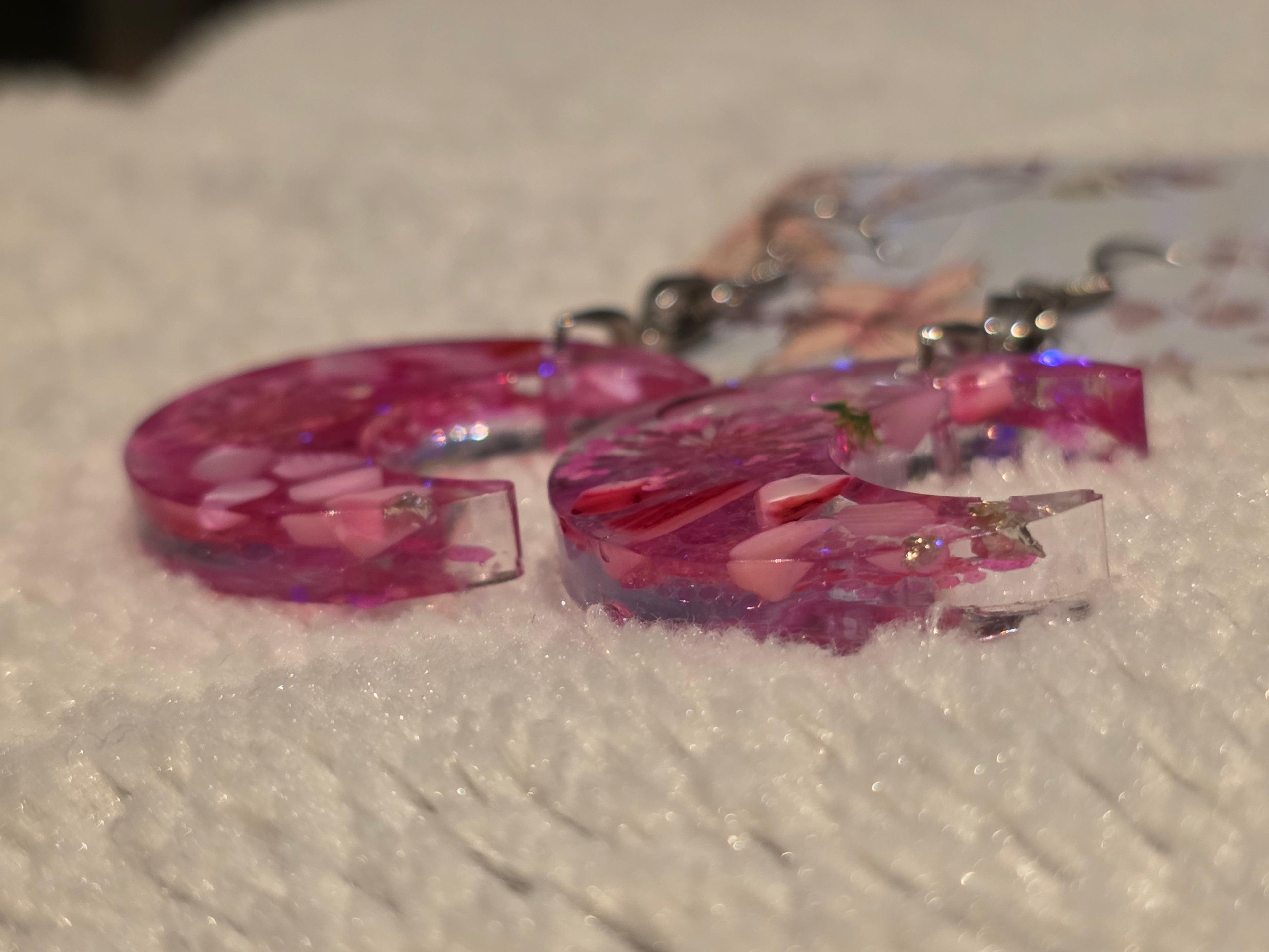Resin earrings – pink crescent moons with glitter effect, stainless-steel hooks