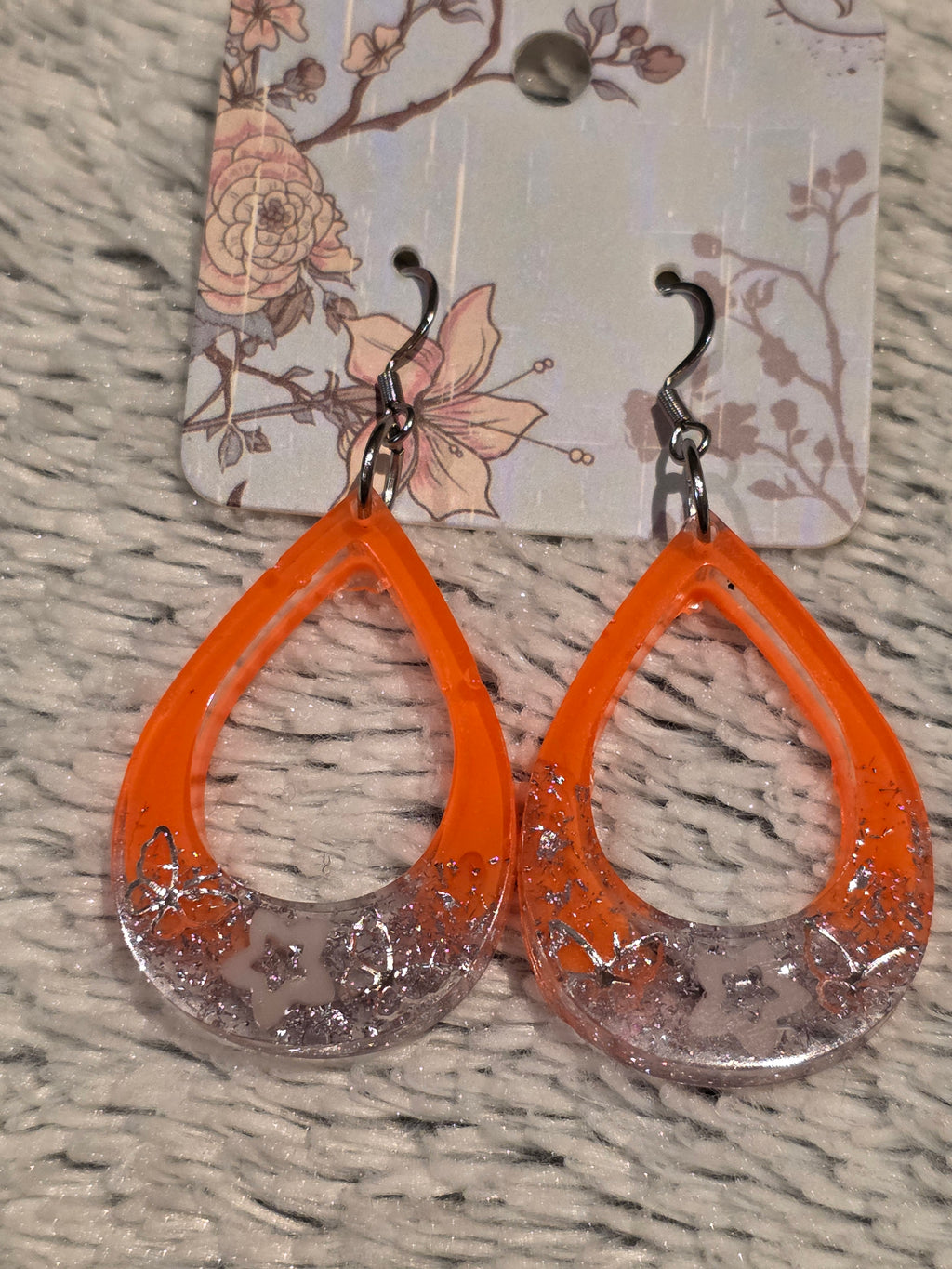 Resin earrings – orange hoops with silver star glitter effect, stainless-steel hooks