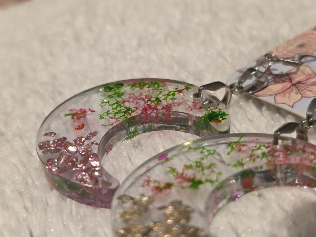 Resin earrings – clear crescent moons with real dried flowers, stainless-steel hooks