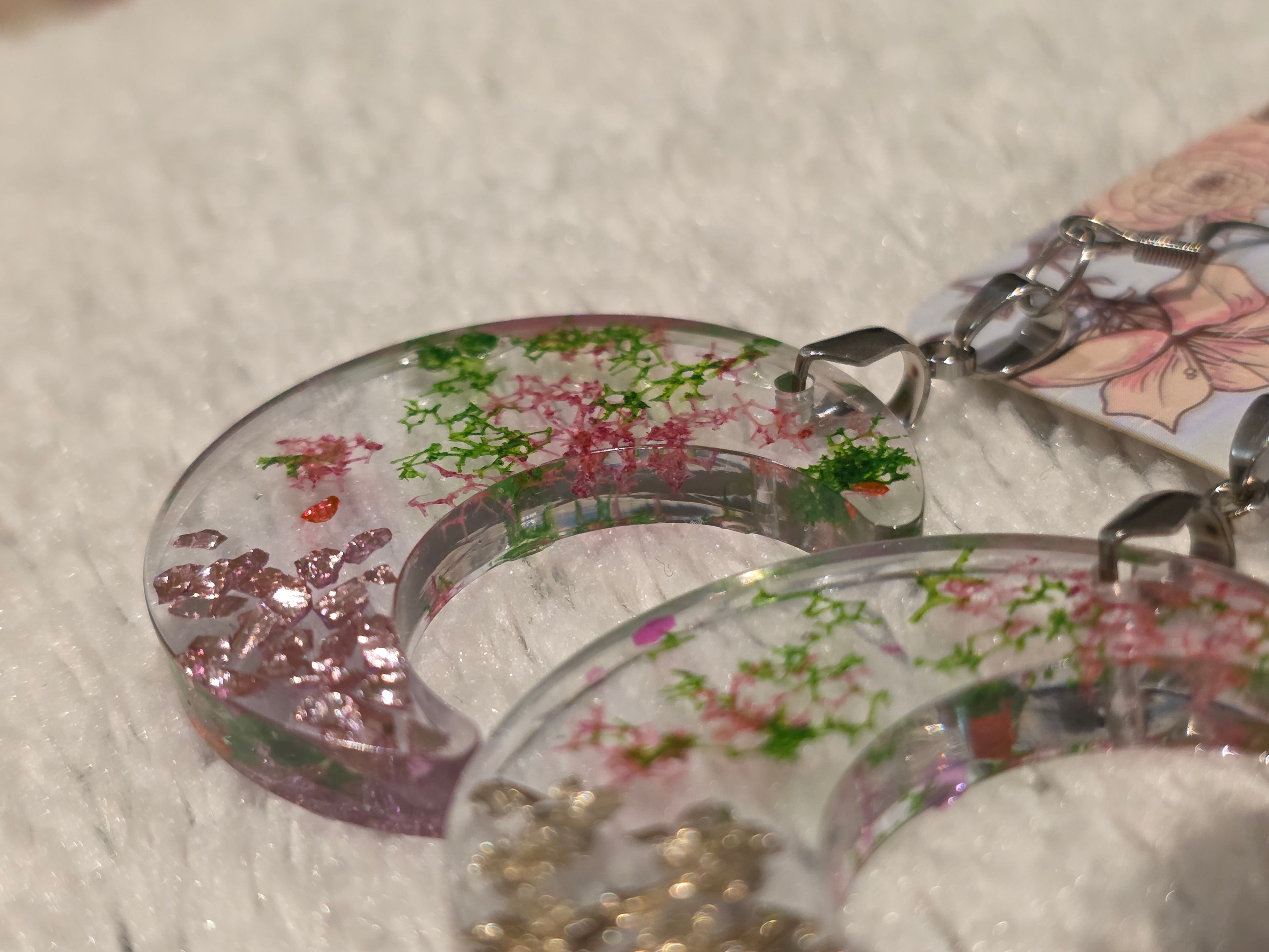 Resin earrings – clear crescent moons with real dried flowers, stainless-steel hooks