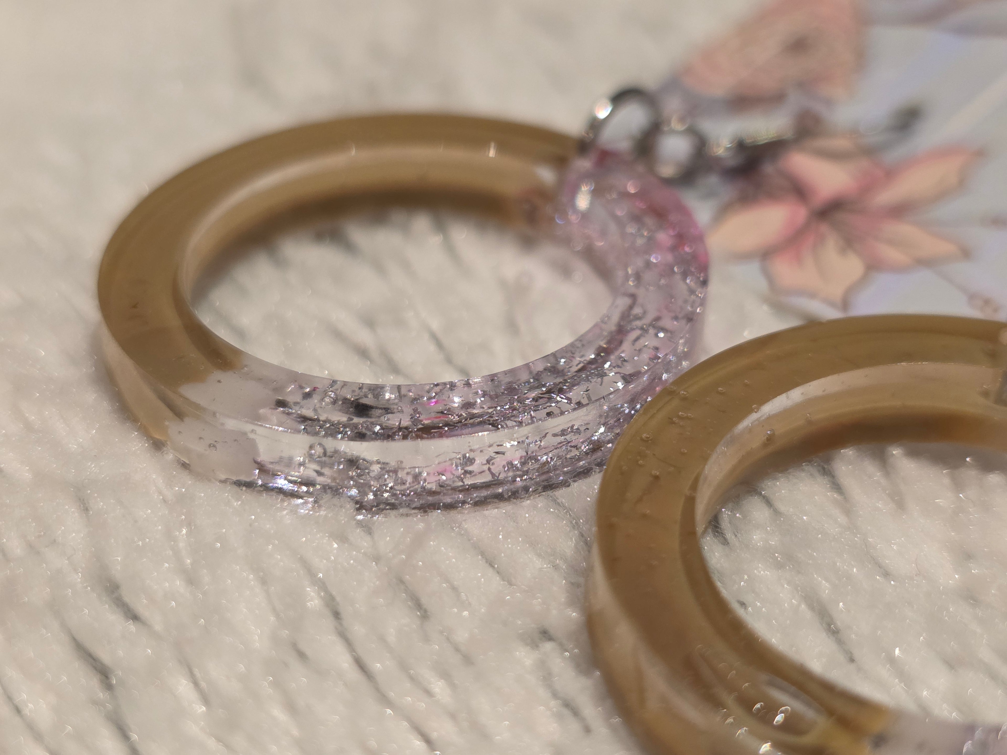 Resin earrings – clear hoops with gold pigment and silver glitter effect, stainless-steel hooks