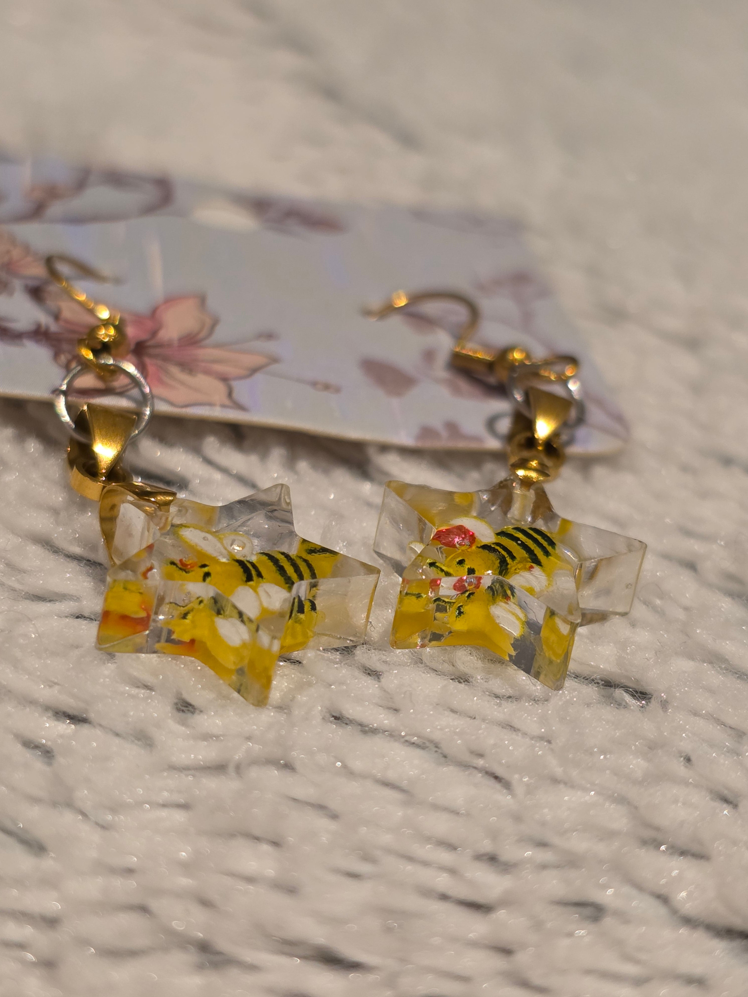 Resin earrings – star charms with bees, gold hooks